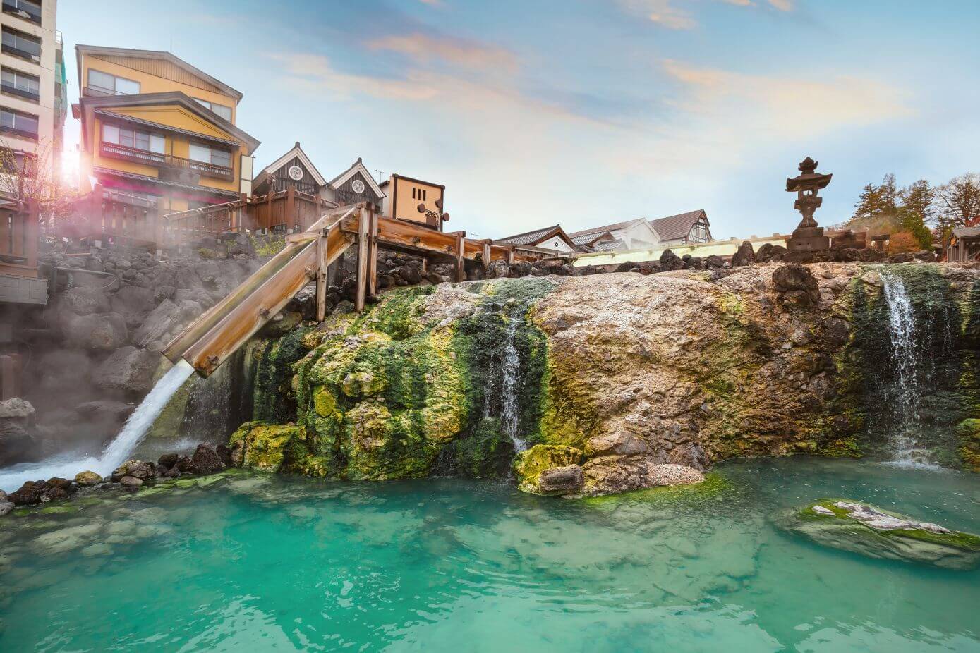 Yubatake - steaming wooden structure where the mineral-rich
									waters are cooled in Kusatsu Onsen